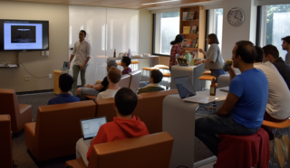 Students listening to a speaker